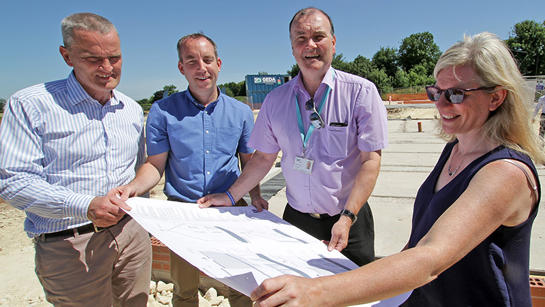 Pelham Team Members Look At Site Plan Pelham Team Members Look At Site Plan