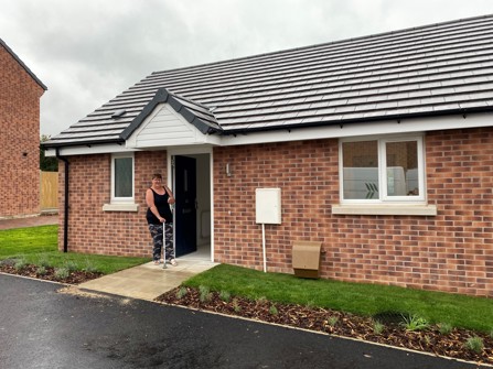 Customer standing outside her new shared ownership home in Walesby.